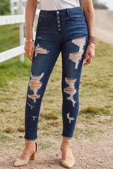 Distressed-Jeans mit Knopfleiste und ungesäumtem Saum