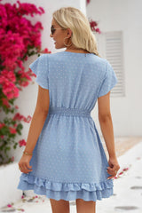 Robe à pois suisses, col surplis, manches flottantes