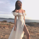Robe longue à manches bouffantes et fente haute, couleur unie