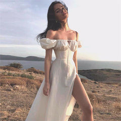 Robe longue à manches bouffantes et fente haute, couleur unie