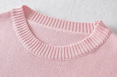 Pull rose à col rond et manches tombantes en maille brodée de fleurs