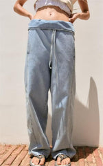 Jean taille haute plissé avec ceinture