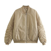 Manteau matelassé en coton kaki à manches plissées et fermeture éclair