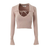 Ensemble haut à manches longues et jupe taille haute en tricot français à lacets et col en V