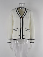 Pull grande taille avec poches assorties et col en V