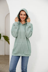 Pull ample à capuche et cordon de serrage de couleur unie