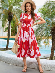 Robe mi-longue imprimée à col rond et manches volantées