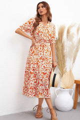 Robe mi-longue à col fleuri et manches bouffantes