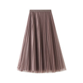 Jupe en maille de velours doré à deux faces, mi-longue, taille haute, plissée en fil