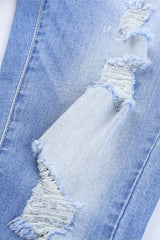 Jean skinny boutonné à la cheville et effiloché