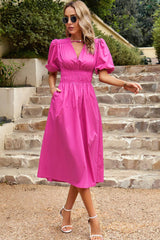 Robe mi-longue à manches bouffantes et taille froncée