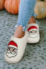 Chaussons blancs en peluche à motif Père Noël