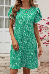 Kleid mit Blumenmuster und Bommeldetail