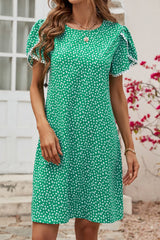 Robe à manches pétales et détails à pompons floraux