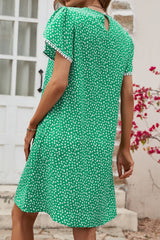 Robe à manches pétales et détails à pompons floraux