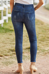 Distressed-Jeans mit Knopfleiste und ungesäumtem Saum