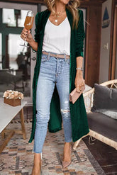 Elegante lange Strickjacke aus grünem Samt mit offener Vorderseite und Taschen