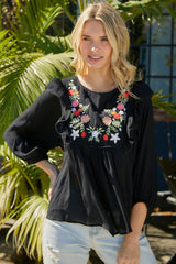 Haut babydoll à volants et broderie florale