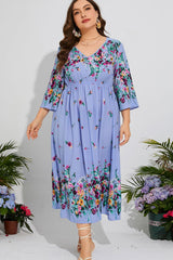 Robe mi-longue fleurie grande taille à col en V et manches trois-quarts