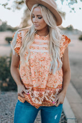 Chemisier sans manches à fleurs et manches flottantes
