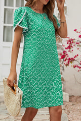 Robe à manches pétales et détails à pompons floraux