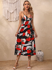 Robe fleurie à bretelles spaghetti et ourlet fendu