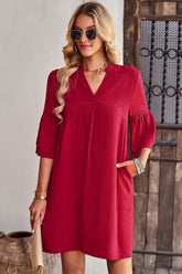 Robe à poches et manches évasées à col cranté