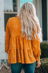 Haut babydoll à manches bouffantes et col rond
