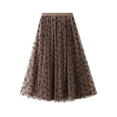 Jupe en gaze plissée amincissante taille haute avec nœud floqué et jupe bidirectionnelle en maille