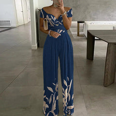 Schulterfreier Jumpsuit mit Büro-Print und kontrollierter Taille