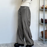 Seitlich gewebte Freizeithose, lockere, schlankmachende Schnürung, elastische Taille, Knöchel gebundene Sporthose