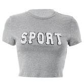 Haut court et large de couleur unie avec broderie alphabet tendance