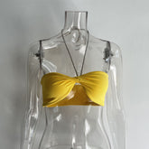 Haut fin jaune élégant à bretelles et col licou, haut tube taille haute, gilet court et slim