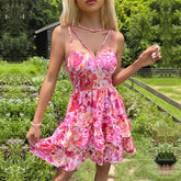 Süßes rückenfreies Spaghettiträgerkleid