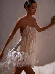 Robe à bretelles perlées en maille double couche à pompons