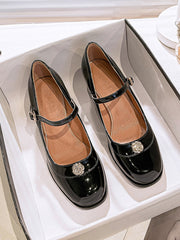 Chaussures à talons mi-hauts en cuir verni à bout rond