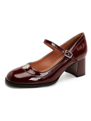 Chaussures à talons mi-hauts en cuir verni à bout rond