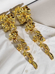 Boucles d'oreilles longues pétales vintage en or