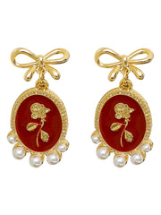 Boucles d'oreilles vintage en forme de nœud et de rose en perles rouges