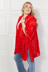 Cardigan poncho asymétrique à pompons Justin Taylor en rouge