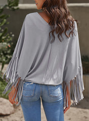 Haut à manches dolman et couture centrale à franges