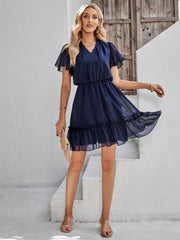 Robe à volants, col noué, manches flottantes