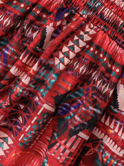 Jupe chasuble à smocks imprimée pour bébé fille