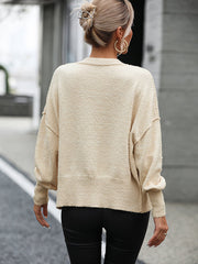 Pull-over en tricot de couleur unie avec col en V et boutons