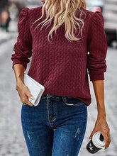 Sweat-shirt à manches longues bouffantes et col rond avec motif torsadé