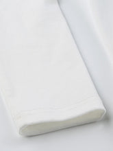 Bauchfreies, schmal geschnittenes, langärmliges Strick-T-Shirt mit Schleifendruck