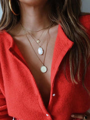 cardigan tricoté à simple boutonnage et manches amples à épaules tombantes de couleur unie