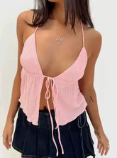 Gilet licou en maille rose avec coutures enveloppantes sur la poitrine