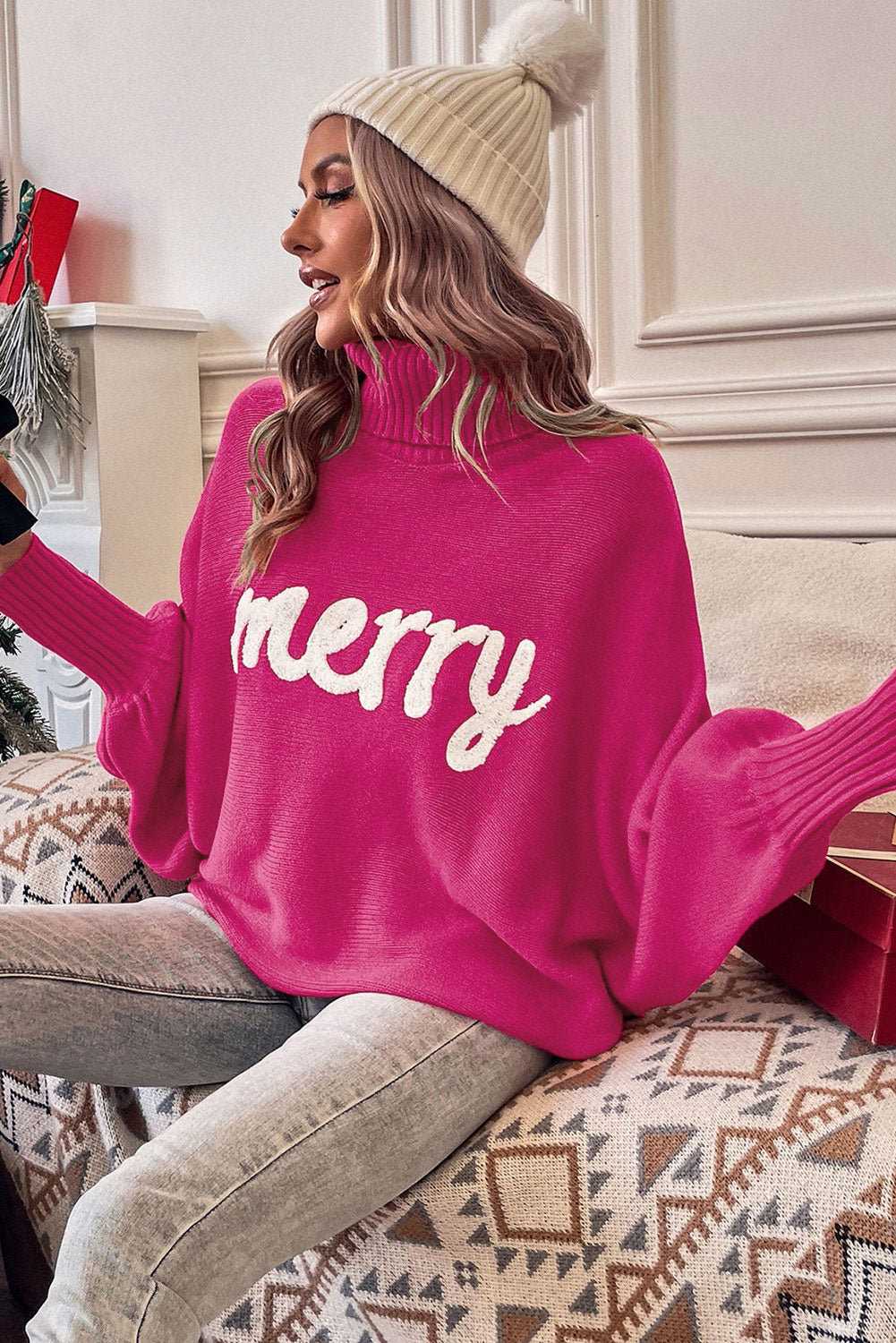Pull rouge à col roulé et manches chauve-souris « Joyeux Noël »