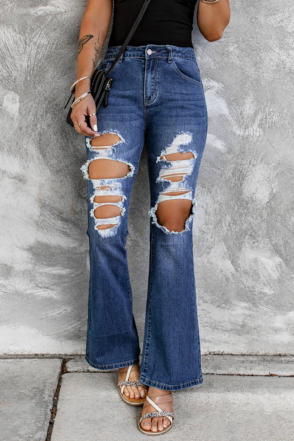 Jean évasé taille haute effet usé